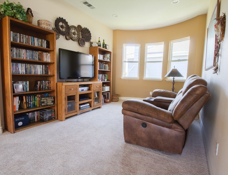 Media family room installed upstairs where a high ceiling once was.