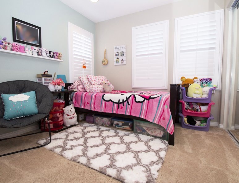 Girls bedroom with glass closet doors and newly installed windows