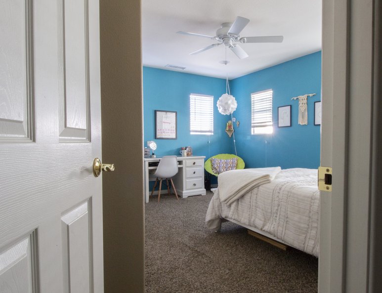 Newly built bedroom with white wood closet sliding doors