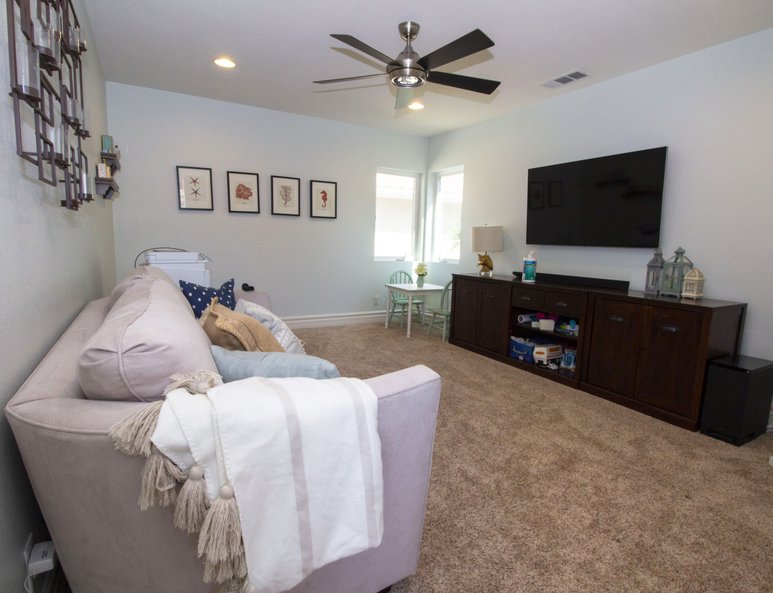 Family room with unique wall art and plenty of room