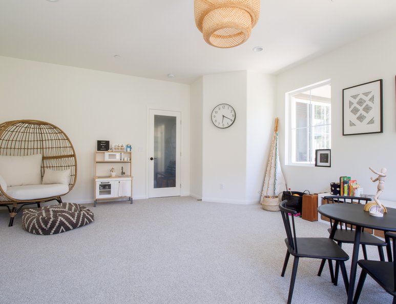 Open loft playroom with frosted glass door