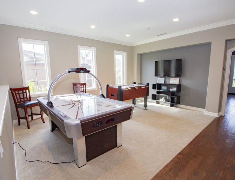 Open loft serving as a family game room.