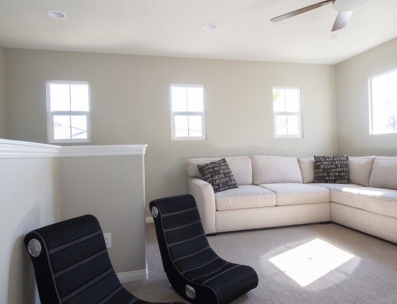 Open loft addition with ample lighting.