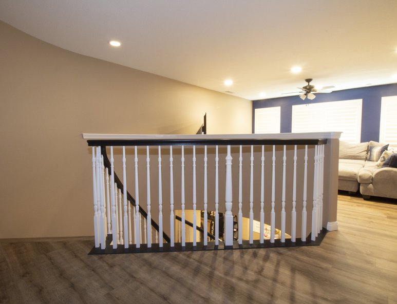 White stairway railing in family room