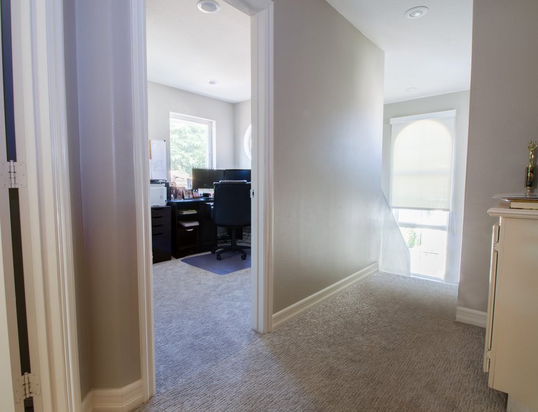 Home office newly installed in unused high ceiling space.