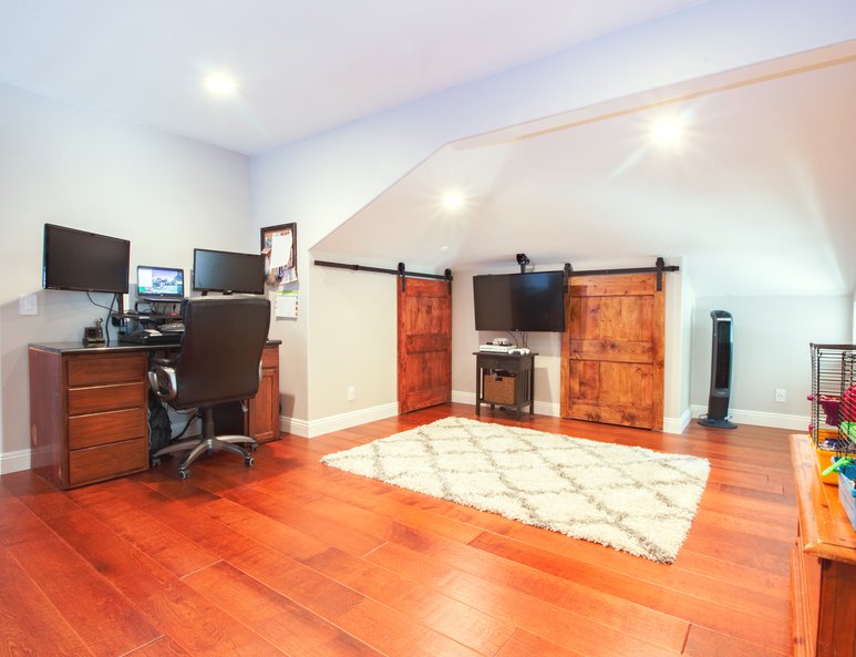 Open loft with sliding door storage, desk area and plenty of room for more